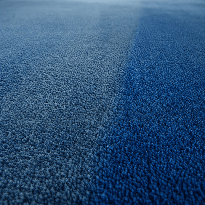 Restored deep blue carpet after professional treatment